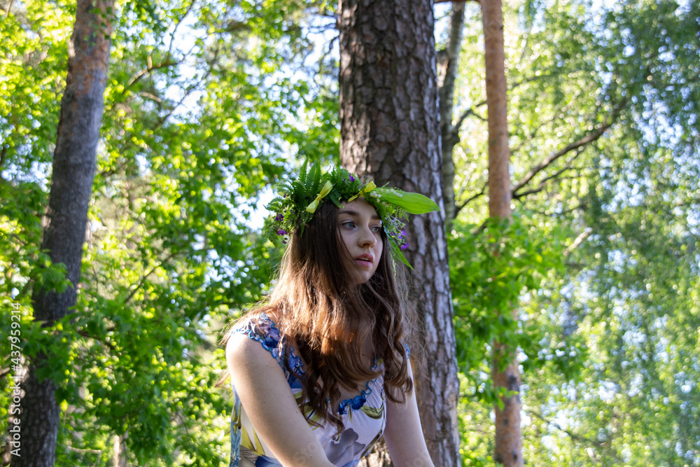 Beautiful blue eye girl in floral crown and dress in the sunnt sumer forest on river side Beautiful blue eye girl in floral crown and dress in the sunnt sumer forest on river side