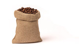 Roasted brown coffee beans. In a burlap sack. On white background.