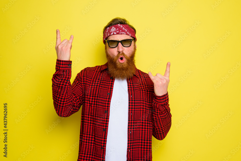 Happy man dances with beard and bandana in head Happy man dances with beard and bandana in head
