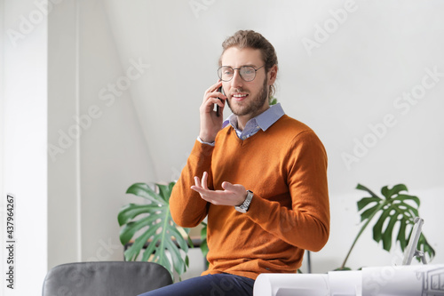 Handsome young man talking ...