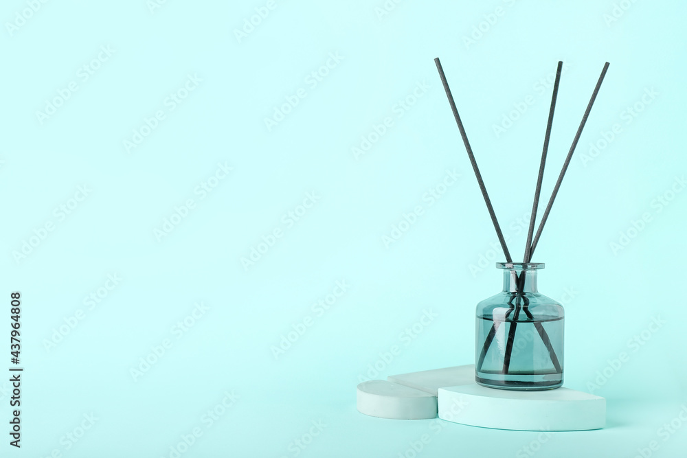 Reed diffuser on color background
