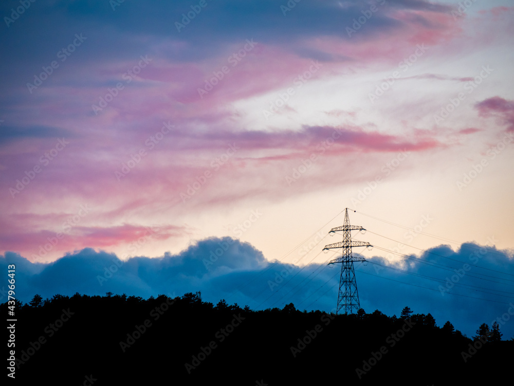 Power transmission tower in the blue cloudy sunset Power transmission tower in the blue cloudy sunset