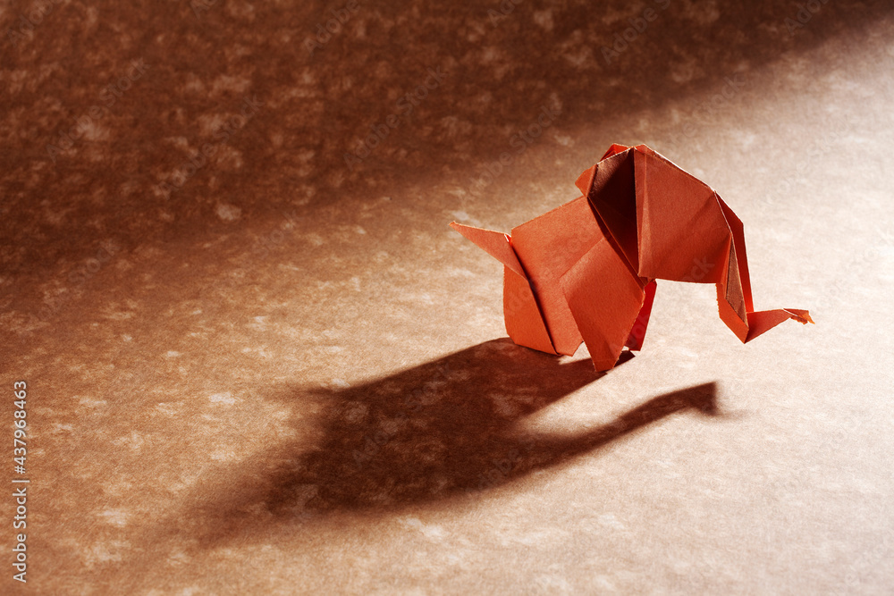 Origami elephants isolated on craft paper background. Origami elephants isolated on craft paper background.