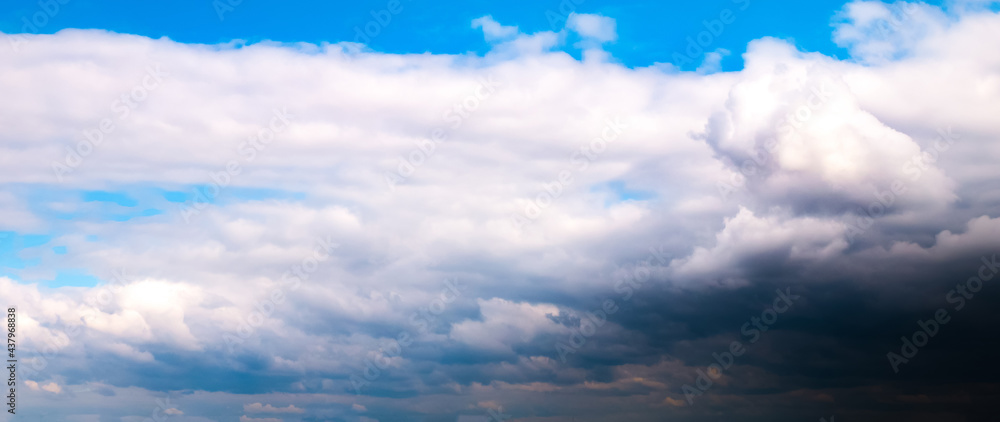 Obraz premium Soft focused Panoramic view of beautiful thunderclouds. Beautiful dramatic blue sky background. Rainy weather. Soft focus photo.