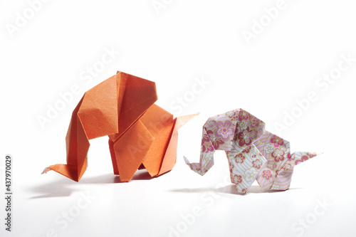 Origami elephants isolated on white background