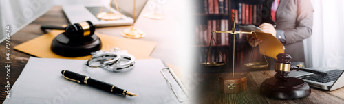 Business and lawyers discussing contract papers with brass scale on desk in office. Law, legal services, advice, justice and law concept picture with film grain effect