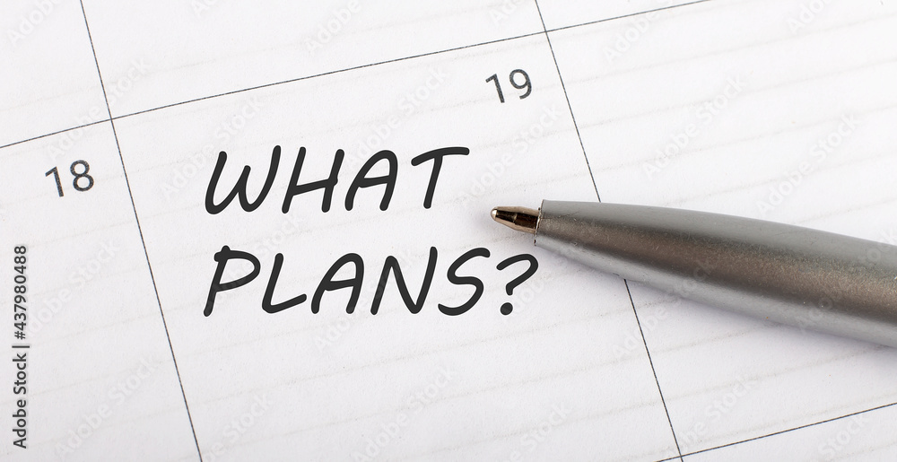 Text WHAT PLANS on calendar planner to remind you an important appointment with a pen on isolated white background. Text WHAT PLANS on calendar planner to remind you an important appointment with a pen on isolated white background.