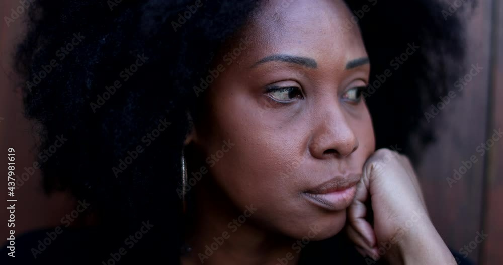 Pensive thoughtful African woman lost in thought Pensive thoughtful African woman lost in thought