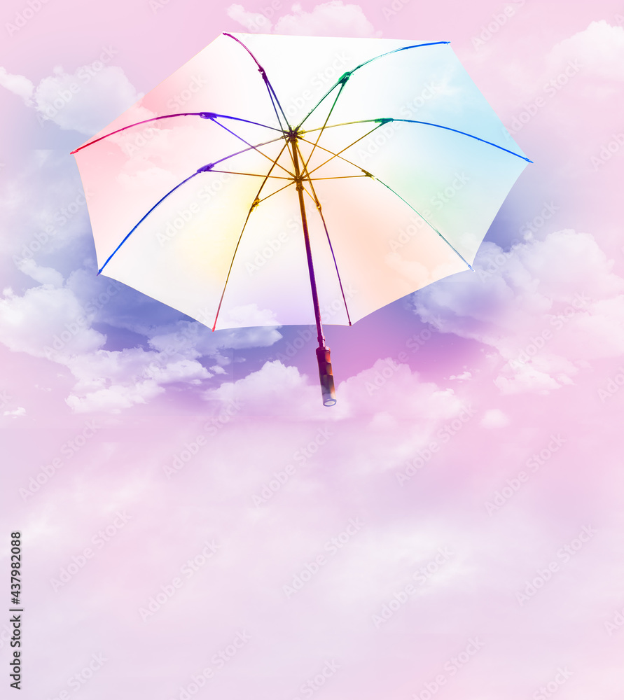 White and rainbow colors umbrella floating over soft clouds candy sky, imagination of holiday in summer season. Abstract idea of sweets outdoor festival with multicolored background. Symbol of freedom