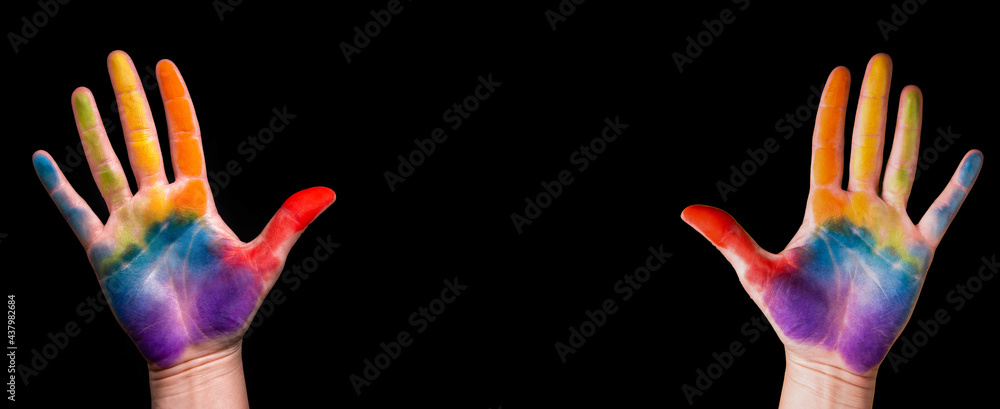 Gay pride concept. The hand is painted with a rainbow. Gay pride lgbt b ...