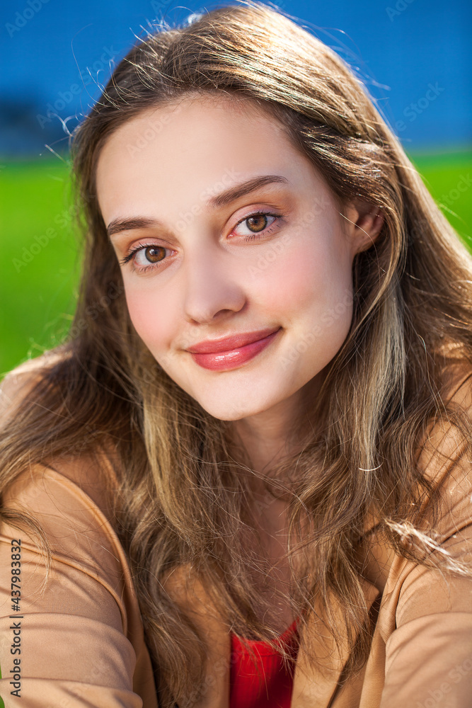 Portrait of a young beautiful woman, summer park outdoor