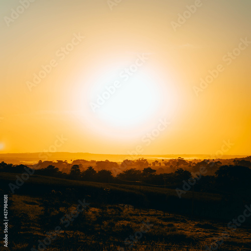 Sunset dust in the pasture with fences