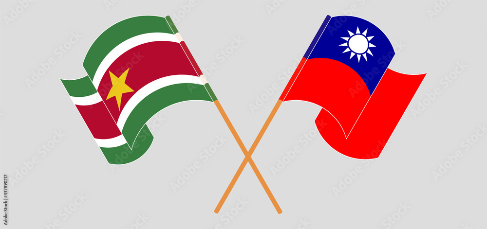 Crossed and waving flags of Suriname and Taiwan