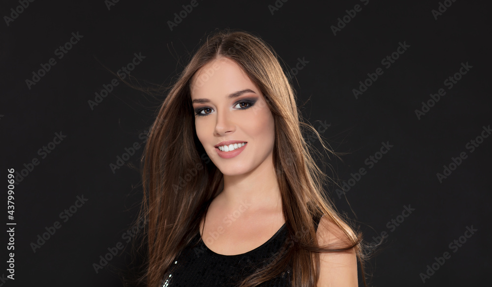 Portrait of beautiful young girl in black dress Portrait of beautiful young girl in black dress