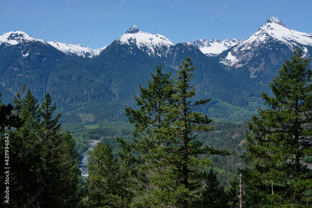 Snowy peaks of Tantalus Range, forest and Cheakamus river, BC
