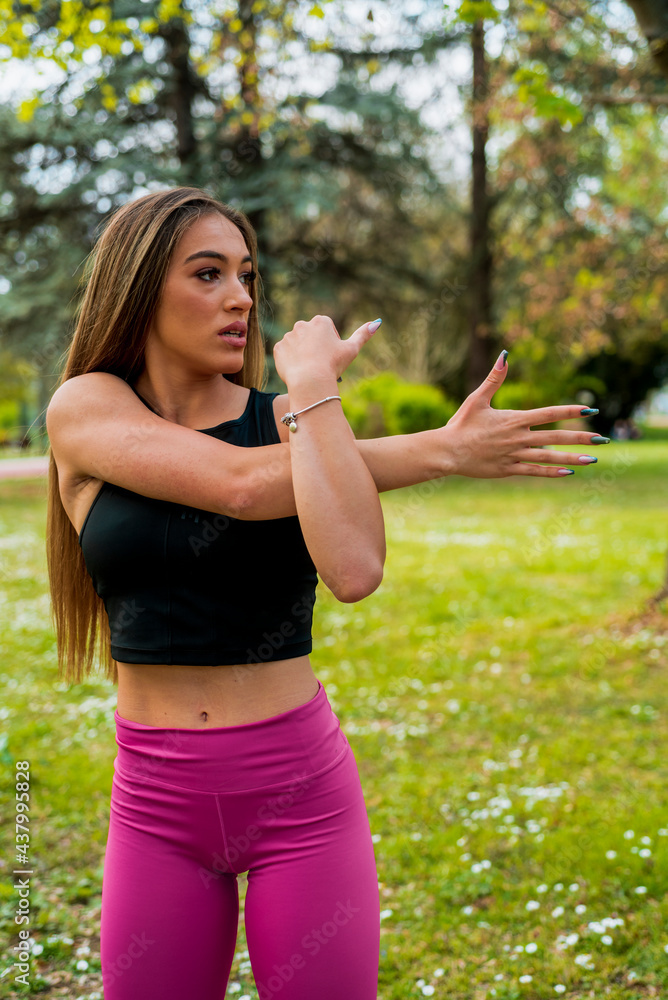 Image of concentrated young sports lady make sport jog exercises Image of concentrated young sports lady make sport jog exercises