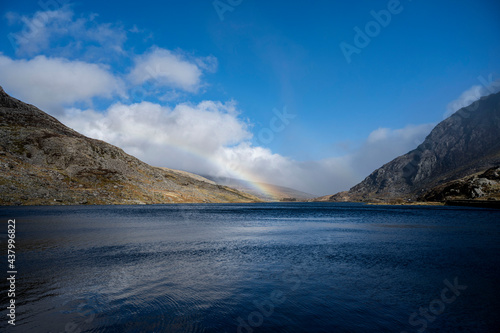 A rainbow over Llyn Idwal  Snowdonia National Park  Wales. Sometimes known as Devil s Kitchen.