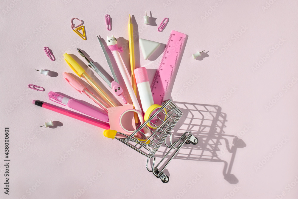 A small super market cart with pink and yellow stationery. Purchases by September 1. Back to school. A small super market cart with pink and yellow stationery. Purchases by September 1. Back to school.