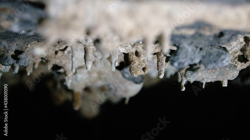 Macro-photograph of a water droplet on a stalactite in a cave in Tasmania.
