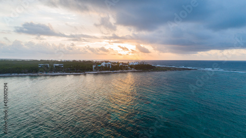 Sunrise shot of a beachfront peninsula in the Caribbean waters of Tulum, Mexico.
