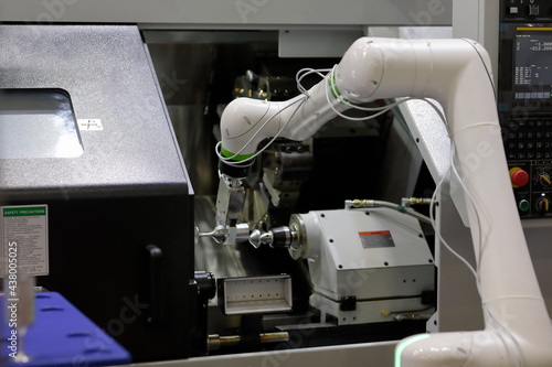 Obraz na płótnie CNC lathe machine and collaborative robot