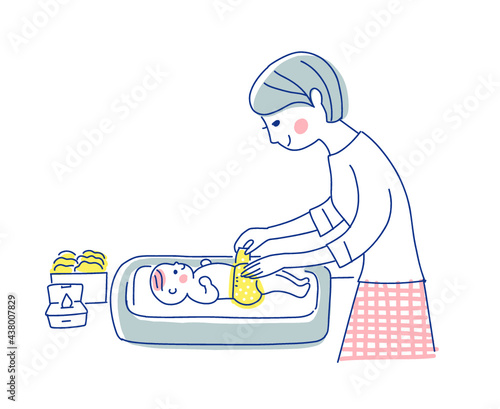 赤ちゃんのおむつ替えをするママ