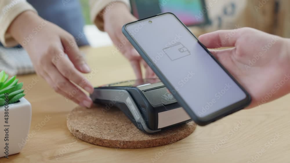 Mobile phone contactless paying cashless e-wallet digital payment. Mobile phone contactless paying cashless e-wallet digital payment.