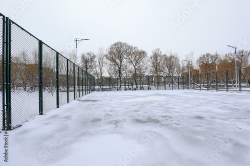 Snow covered tennis court, North China