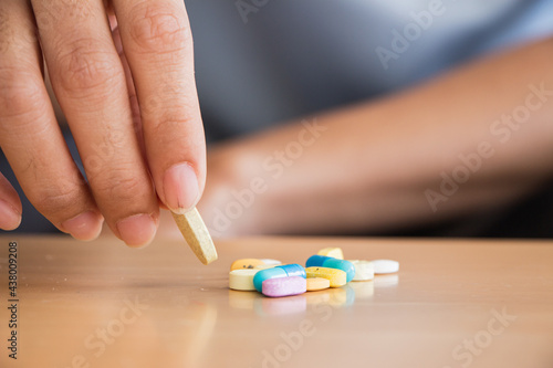 woman at the nursing home concept. concept.woman feel happy at the pill in her hand.