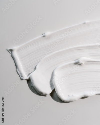 Fototapeta White cream texture on a white background.