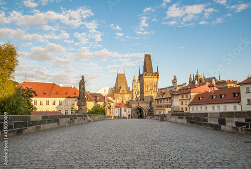 View of Prague, Charles bridge, Vltava river, St. Vitus cathedral on a sunny day