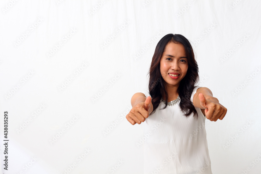 Portrait of happy asian girl standing and smiling while showing her thumbs up. Isolated on white background Portrait of happy asian girl standing and smiling while showing her thumbs up. Isolated on white background