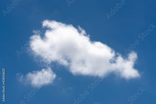 Beautiful cloudscape of nature single white cloud on blue sky background in daytime