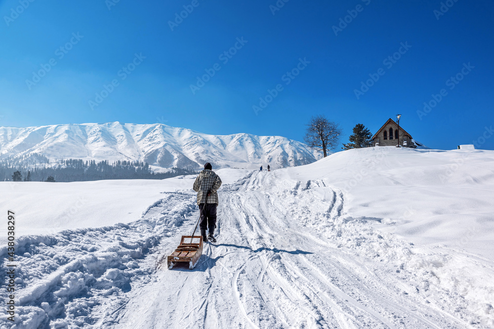 Local Kashmiri driving sledge in winter season, Gulmarg, Kashmir
