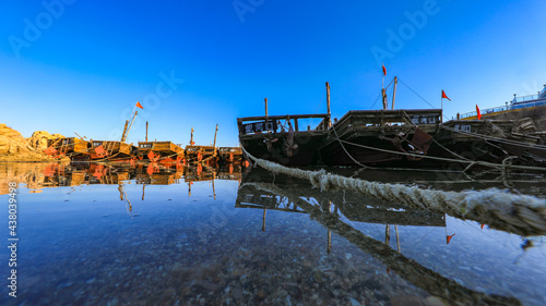 Wooden fishing boats dock in the harbor, North China