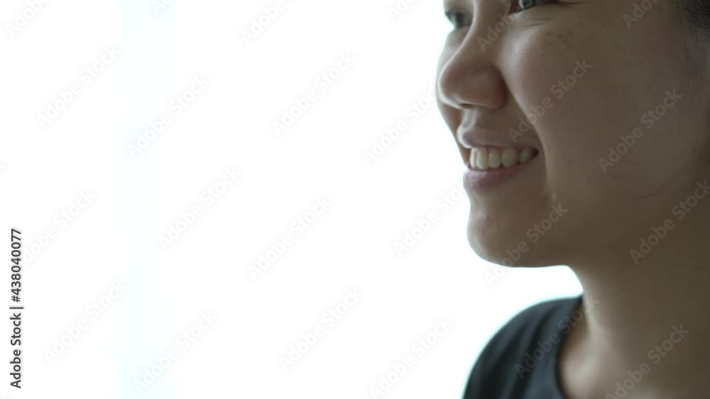 Beautiful happy Asian young woman taking off her hygiene protective face mask. Beautiful happy Asian young woman taking off her hygiene protective face mask.