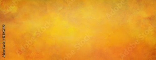 Orange background. Fall or autumn colors of hot yellow and orange with old watercolor grunge texture