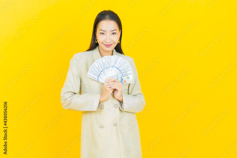 Portrait beautiful young asian woman smile with a lot of cash and money