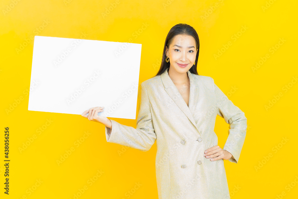 Portrait beautiful young asian woman with empty white billboard Portrait beautiful young asian woman with empty white billboard