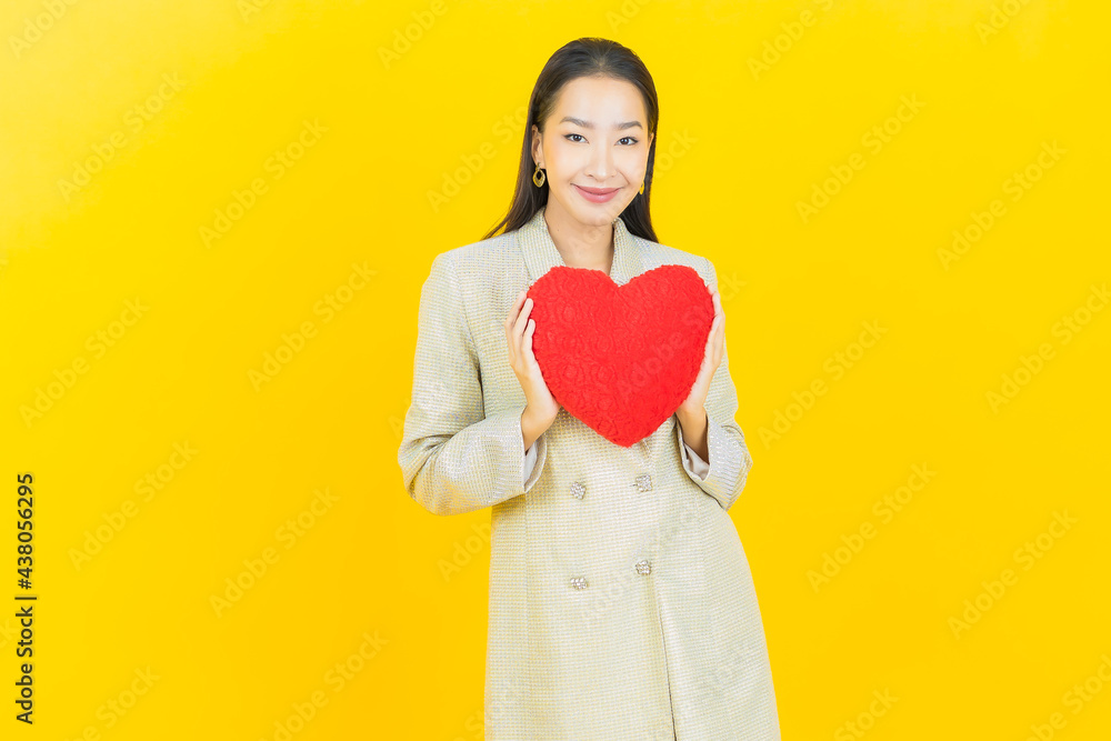 Portrait beautiful young asian woman smile with heart pillow shape Portrait beautiful young asian woman smile with heart pillow shape