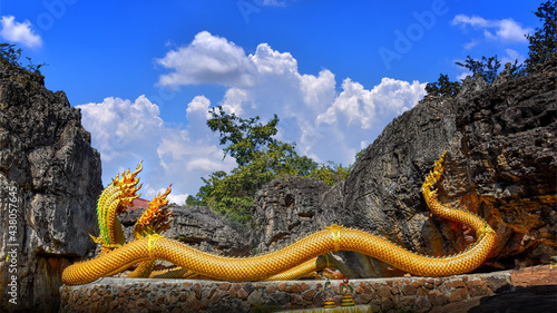 Twin Stucco painted as a large serpent on the mountains at Wat Phu Taphao Thong temple Udon thani province Thailand. Most famous temple. photo