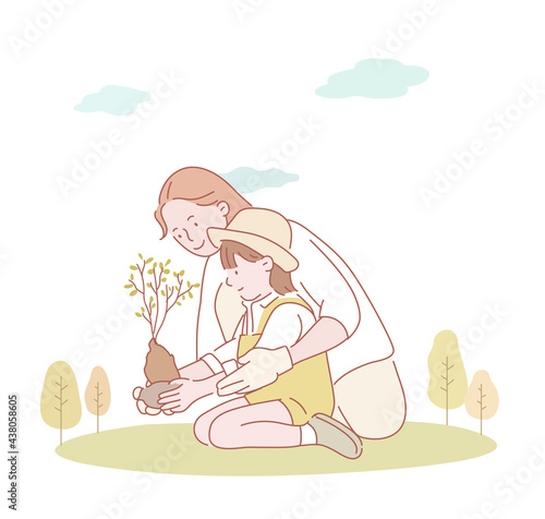 Mother and daughter are planting seedlings together. hand drawn style vector design illustrations. 