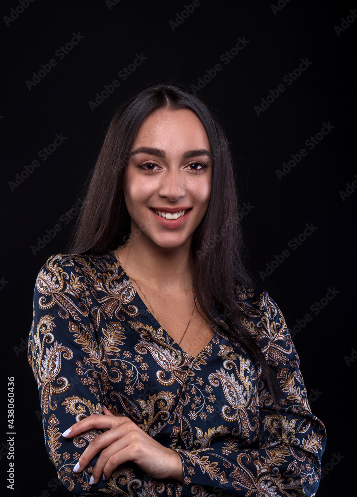 portrait of a young woman in the studio on a dark background portrait of a young woman in the studio on a dark background