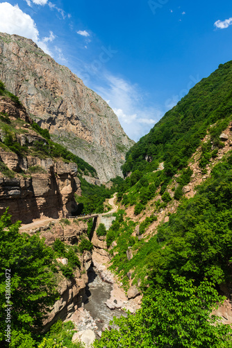 Tourists on a bridge in a mountain gorge