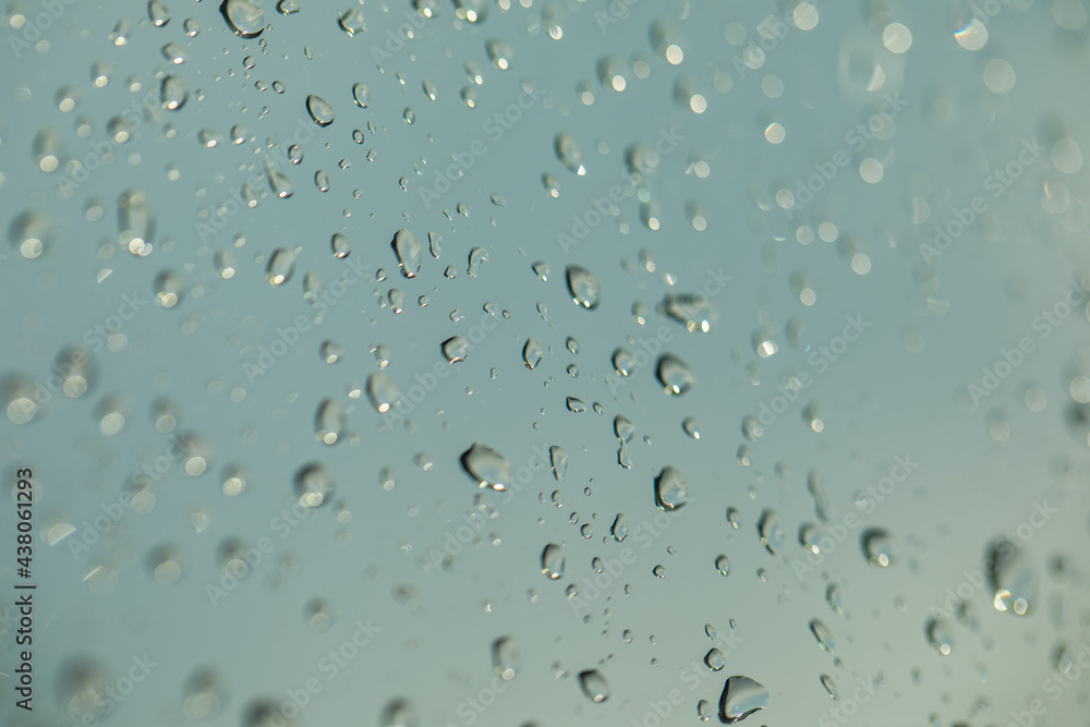 Water drop, rain drops on glass and dripping down Water drop, rain drops on glass and dripping down