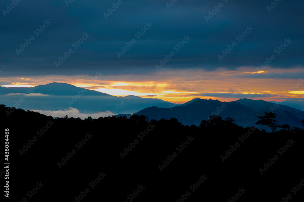 Beautiful sunshine at misty morning mountains at north thailand