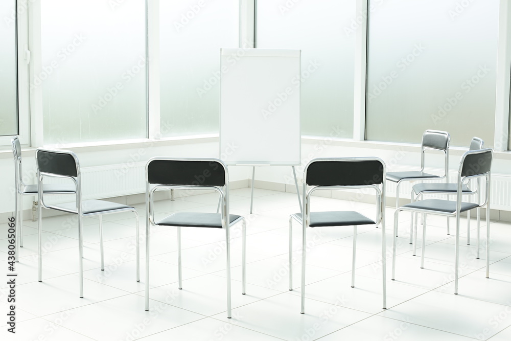 Flipchart chairs in a bright office spacious space Flipchart chairs in a bright office spacious space
