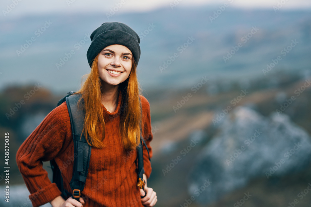 Cheerful female tourist backpack nature mountains landscape travel
