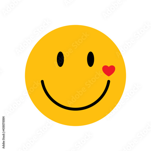 Yellow face with little heart on the cheek, vector.
