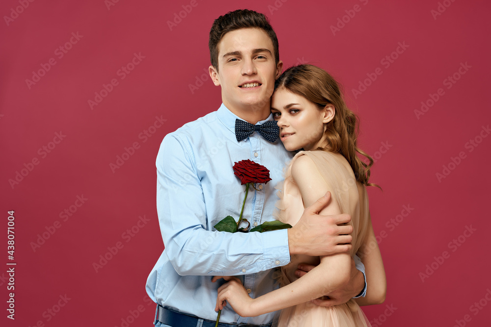 man and woman hugs flowers luxury gift pink background man and woman hugs flowers luxury gift pink background